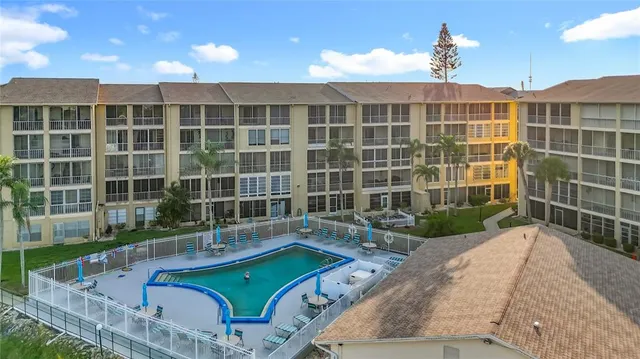 swimming pool view with a seating space