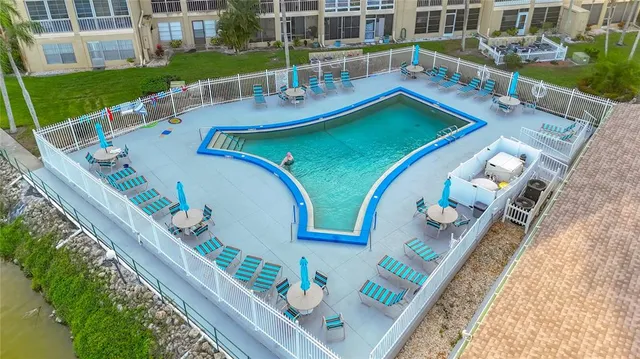 a view of a swimming pool with a yard