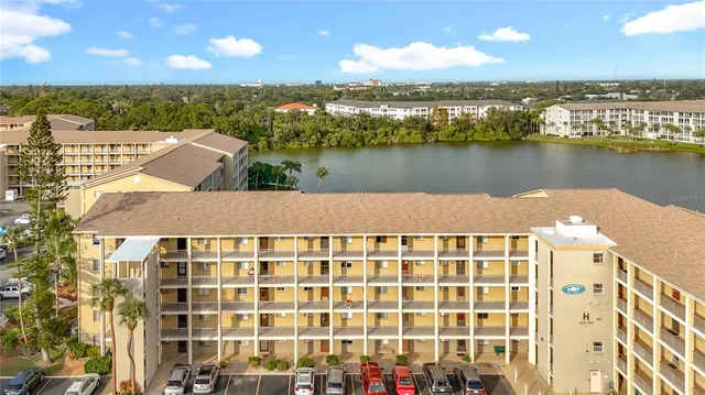 a front view of a building with a garden