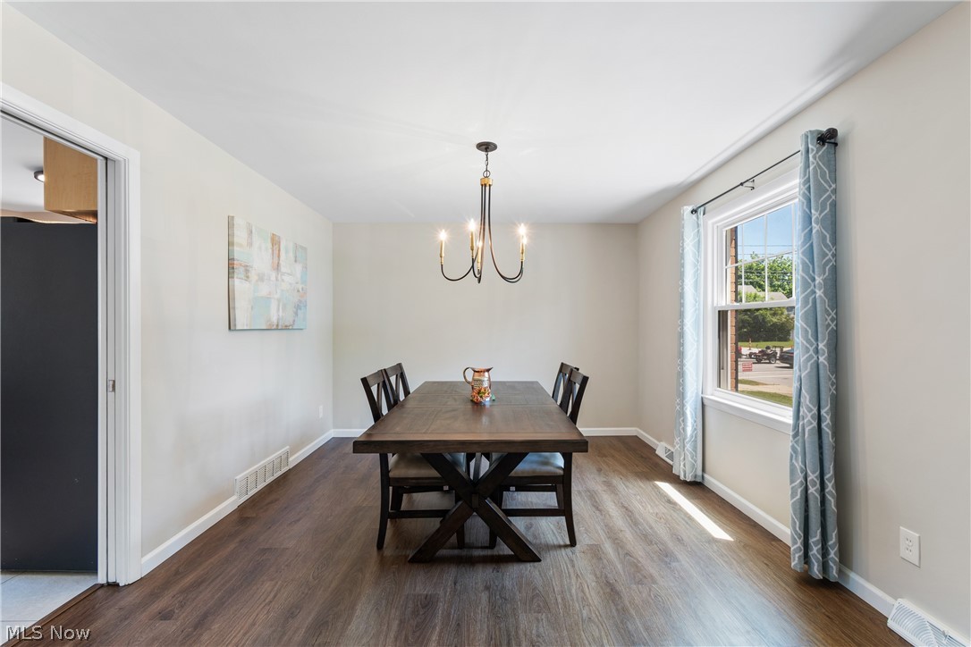 4503 Groveland Road University Heights, OH 44118 - Photo 11 of 31 Dining room with a notable chandelier and hardwood / wood-style floors