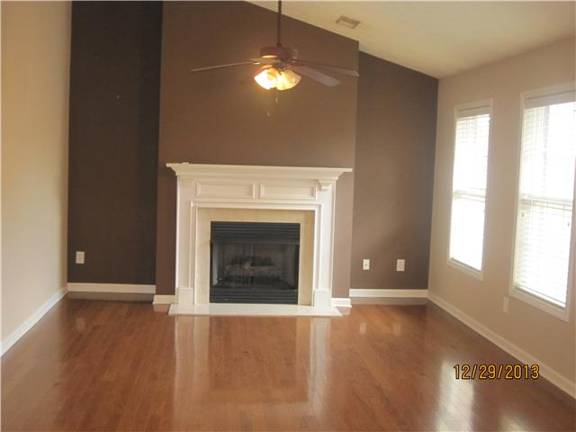 816 Lock 4 Road Gallatin, TN 37066 - Photo 1 of 12 Living room- gas logs, custom paint, cathedrel ceilings. large windows