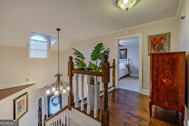 a view of an entryway with wooden floor
