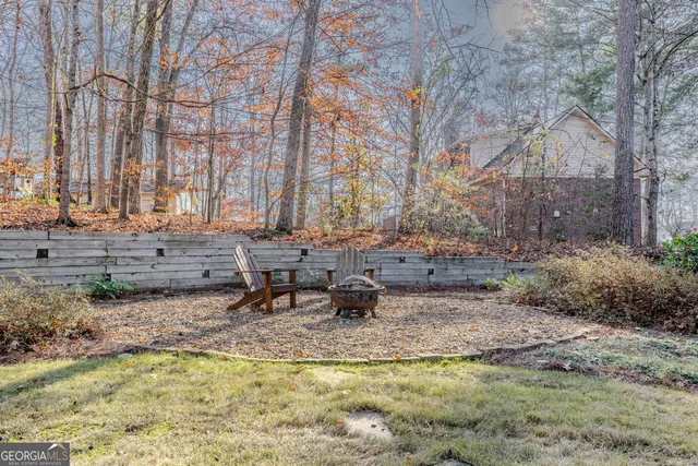 a view of swimming pool with a sitting area