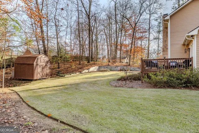 a swimming pool with outdoor seating and yard