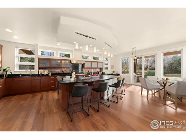 a kitchen with a stove a sink and a wooden cabinets