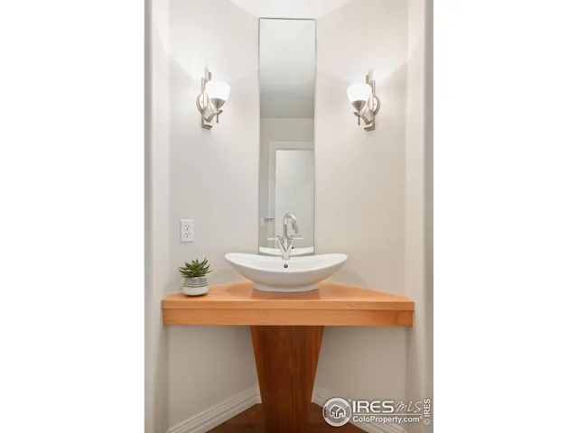 a open white kitchen with sink dryer and washer