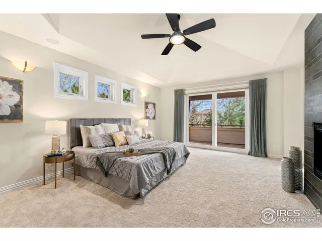 a bedroom with a bed and a fireplace