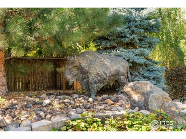 a view of a house with a yard porch and furniture