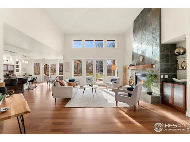 a kitchen with stainless steel appliances kitchen island granite countertop a table and chairs