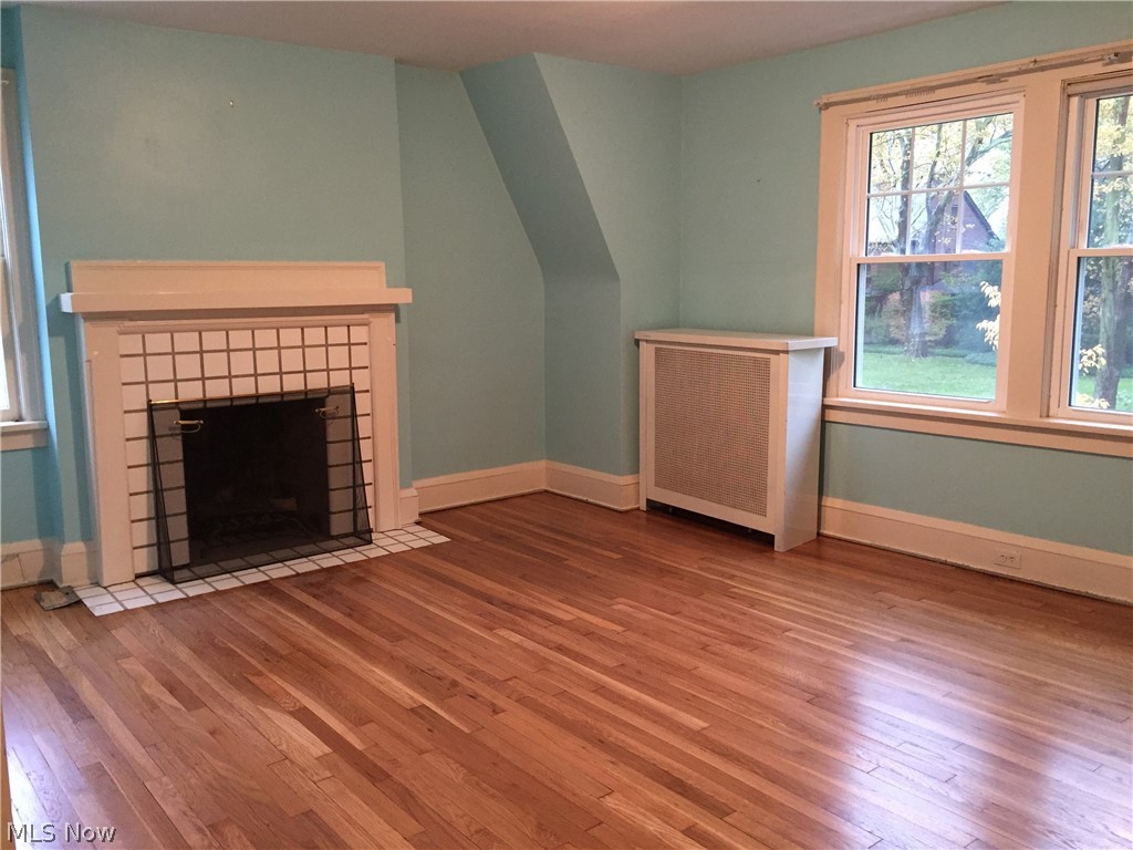 3133 Chadbourne Road Cleveland, OH 44120 - Photo 8 of 18 Master bedroom features fireplace and beautiful floors