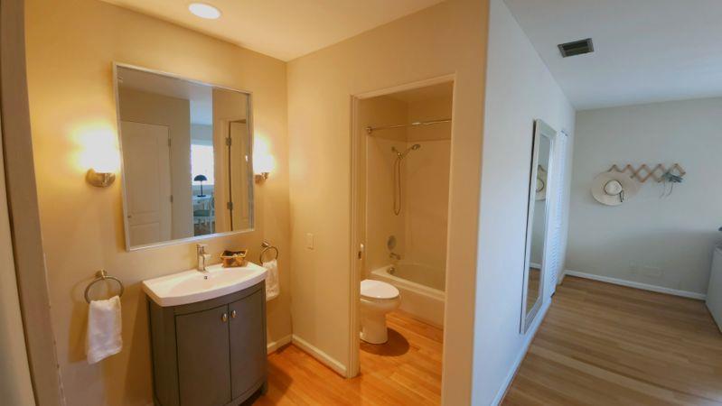 3850 Rio Road, Unit 57 Carmel, CA 93923 - Photo 11 of 25 a bathroom with a sink and mirror