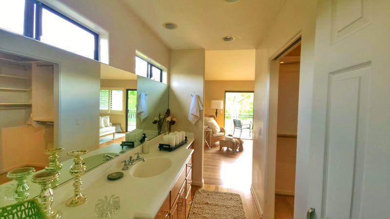3850 Rio Road, Unit 57 Carmel, CA 93923 - Photo 17 of 25 a en suite bathroom with sink and mirror