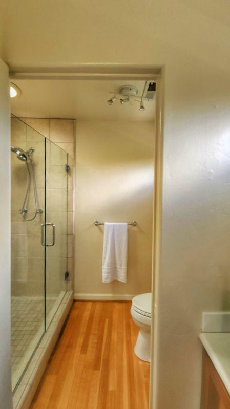 3850 Rio Road, Unit 57 Carmel, CA 93923 - Photo 19 of 25 a bathroom with a shower and a toilet