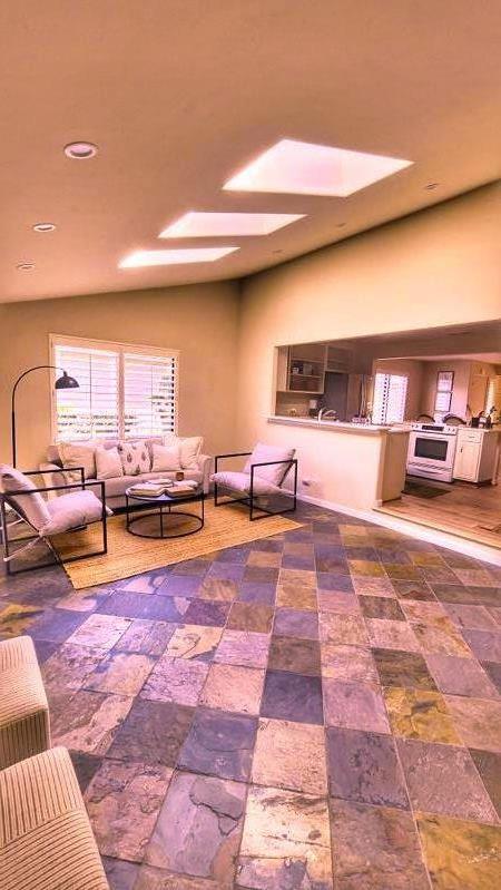 3850 Rio Road, Unit 57 Carmel, CA 93923 - Photo 2 of 25 a gym room with lots of furniture and a rug