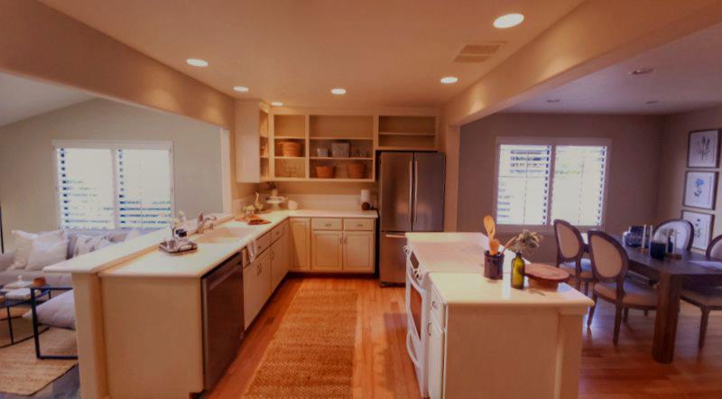 3850 Rio Road, Unit 57 Carmel, CA 93923 - Photo 4 of 25 a kitchen that has a sink and a stove in it