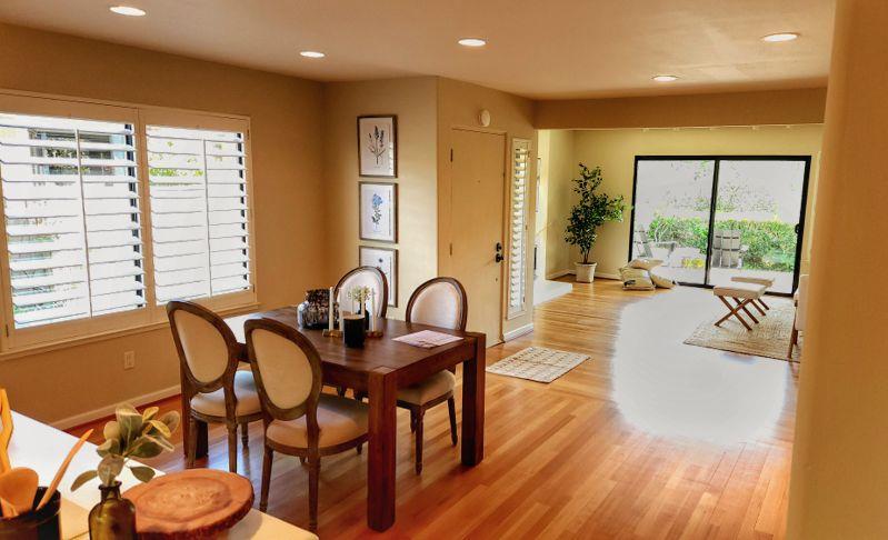 3850 Rio Road, Unit 57 Carmel, CA 93923 - Photo 7 of 25 a dining room with furniture and wooden floor