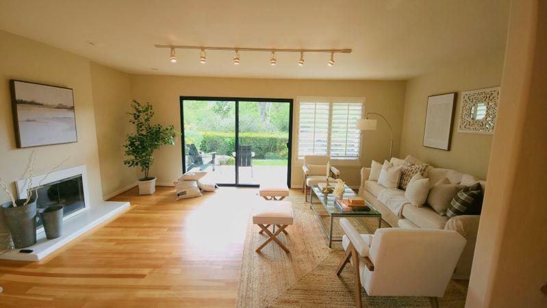 3850 Rio Road, Unit 57 Carmel, CA 93923 - Photo 9 of 25 a living room with furniture and a fireplace