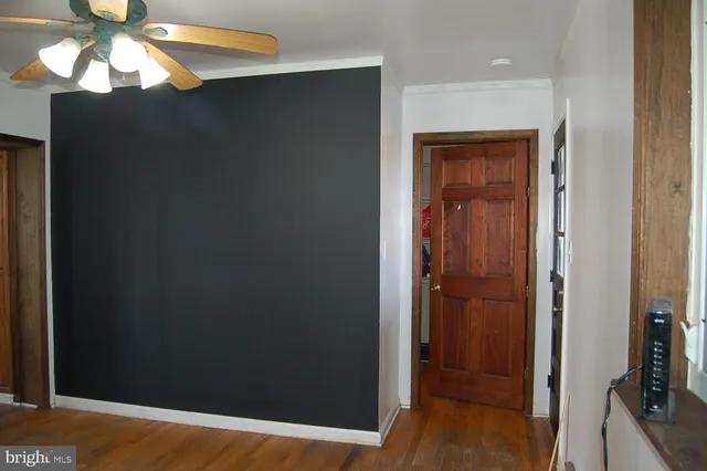 a view of a hallway to a bedroom