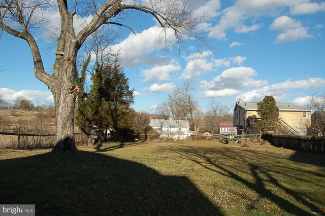 a view of a house with a snow on the yard