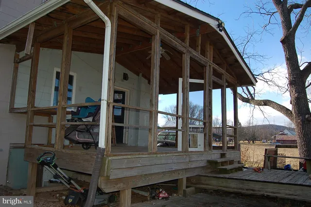 a view of a two chairs on the roof deck