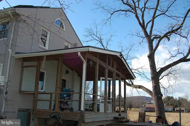 a view of a house with a tree
