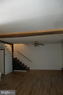 a view of a hallway with staircase