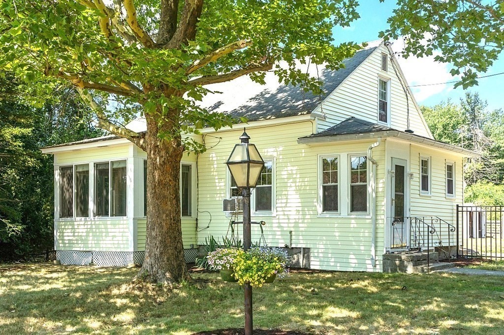175 Forge Village Road Groton, MA 01450 - Photo 1 of 26 a view of a house with a yard