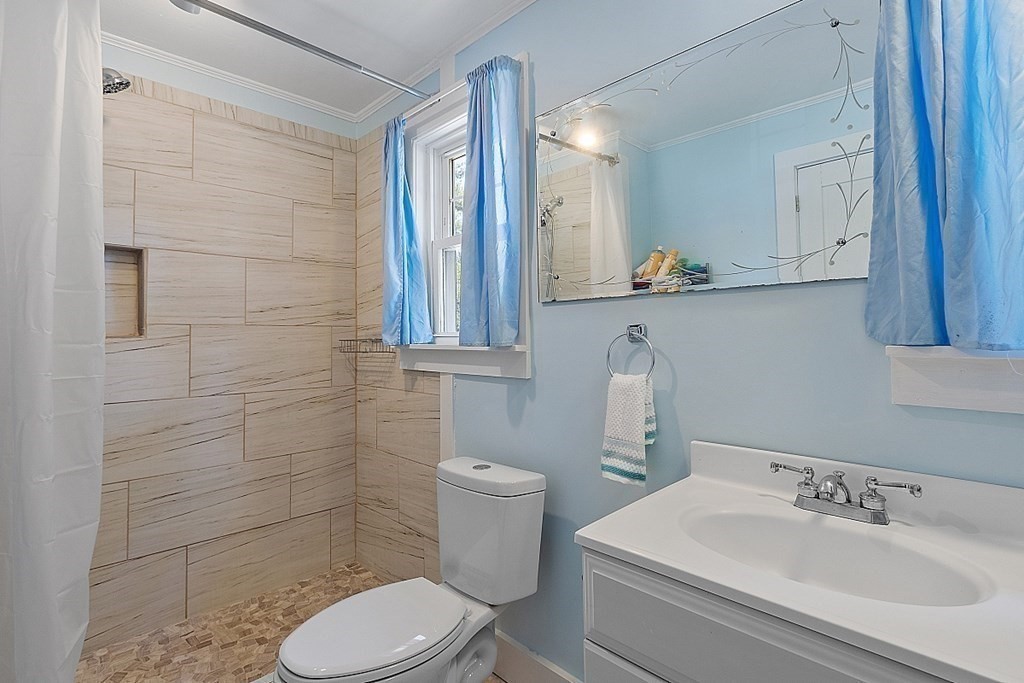 175 Forge Village Road Groton, MA 01450 - Photo 16 of 26 a bathroom with a sink a toilet and shower
