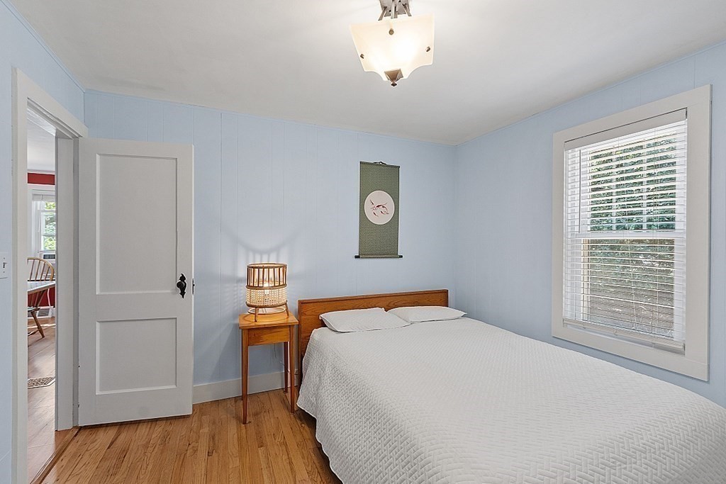 175 Forge Village Road Groton, MA 01450 - Photo 17 of 26 a bedroom with a bed and a window
