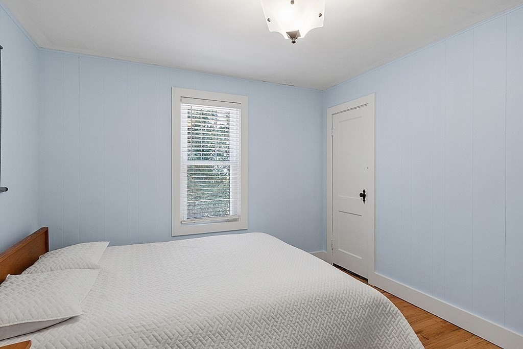 175 Forge Village Road Groton, MA 01450 - Photo 18 of 26 a bedroom with a bed and a window