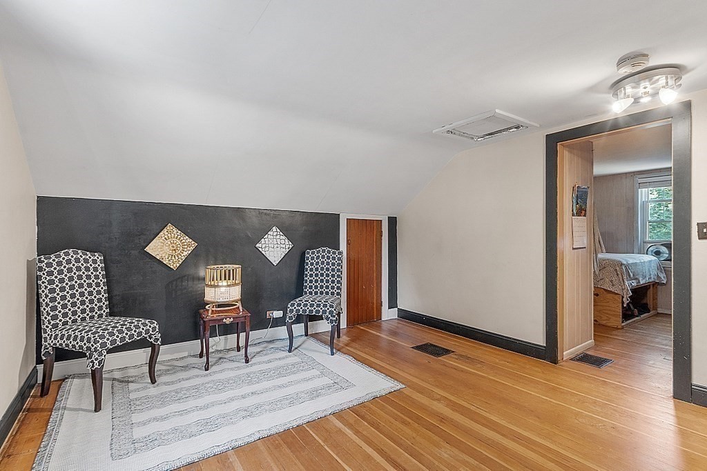 175 Forge Village Road Groton, MA 01450 - Photo 22 of 26 a view of a livingroom with furniture and wooden floor