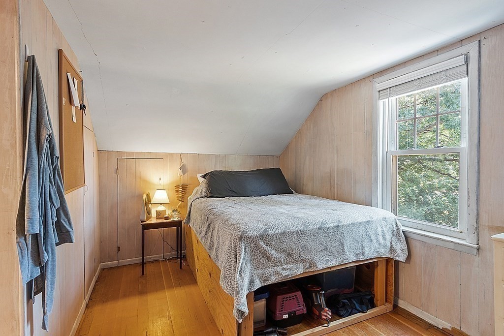 175 Forge Village Road Groton, MA 01450 - Photo 23 of 26 a bedroom with a bed and a window