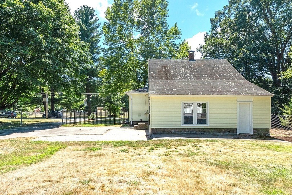 175 Forge Village Road Groton, MA 01450 - Photo 26 of 26 a house that has a tree in front of it