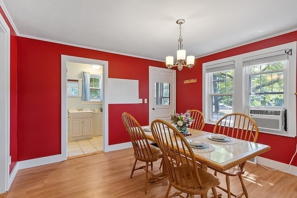 175 Forge Village Road Groton, MA 01450 - Photo 6 of 26 a view of a dining room with furniture window and wooden floor