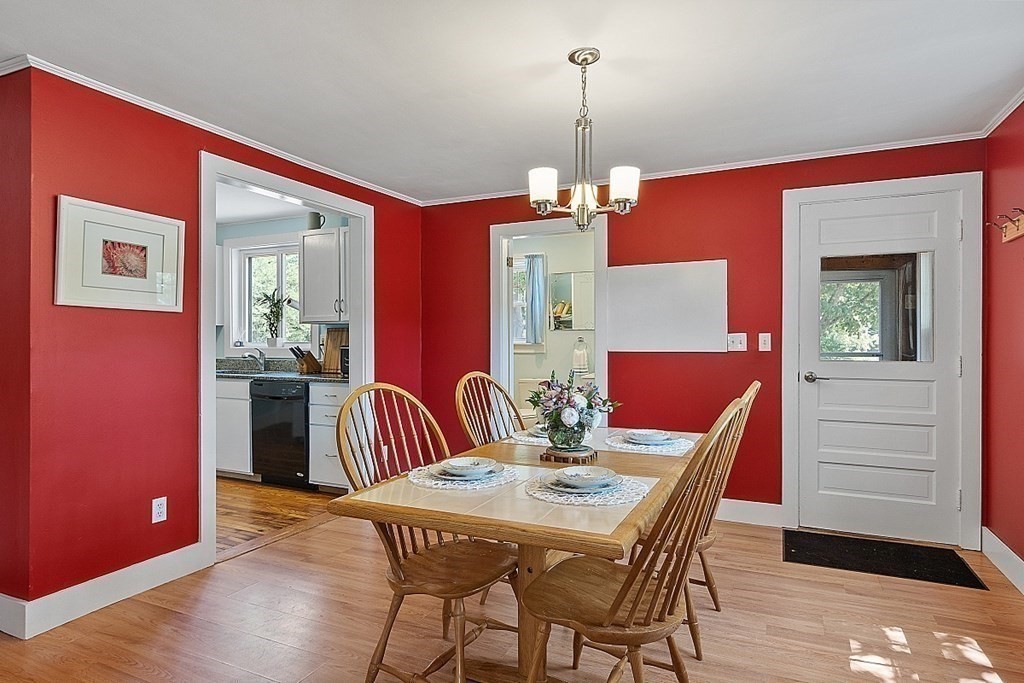 175 Forge Village Road Groton, MA 01450 - Photo 7 of 26 a view of a dining room with furniture and wooden floor