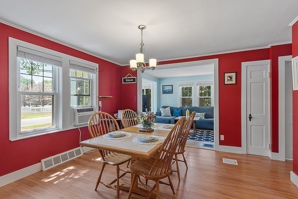 175 Forge Village Road Groton, MA 01450 - Photo 8 of 26 a view of a dining room with furniture window and wooden floor