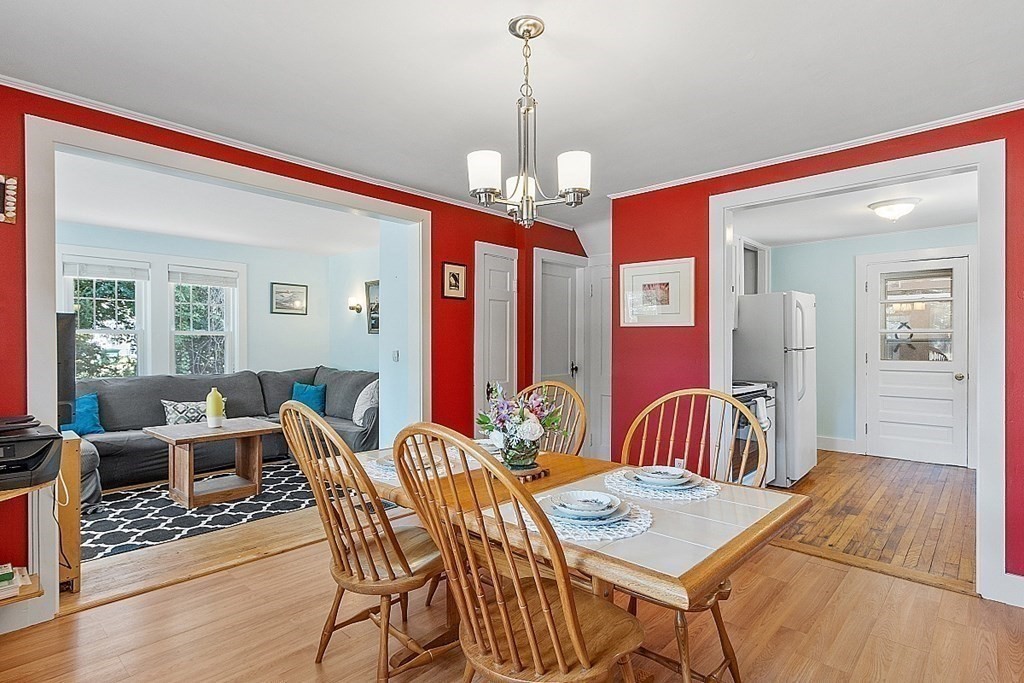 175 Forge Village Road Groton, MA 01450 - Photo 9 of 26 a view of a dining room with furniture window and wooden floor