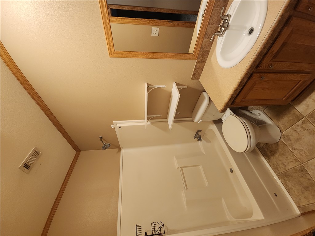 3738 Smetana Road Bryan, TX 77807 - Photo 19 of 29 a bathroom with a toilet sink and shower