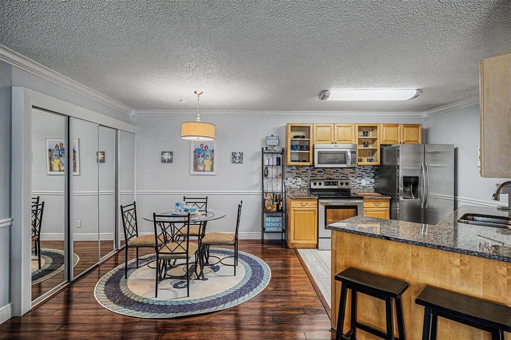 1550 South Belcher Road, Unit 525 Clearwater, FL 33764 - Photo 9 of 28 a kitchen with a table and chairs