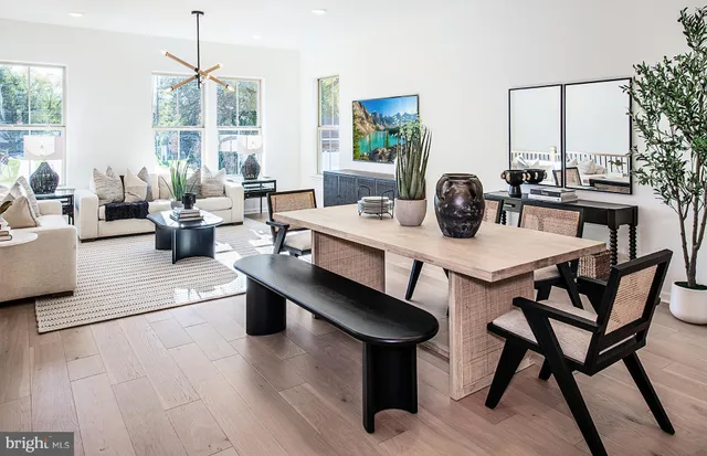 a dining room with furniture and wooden floor