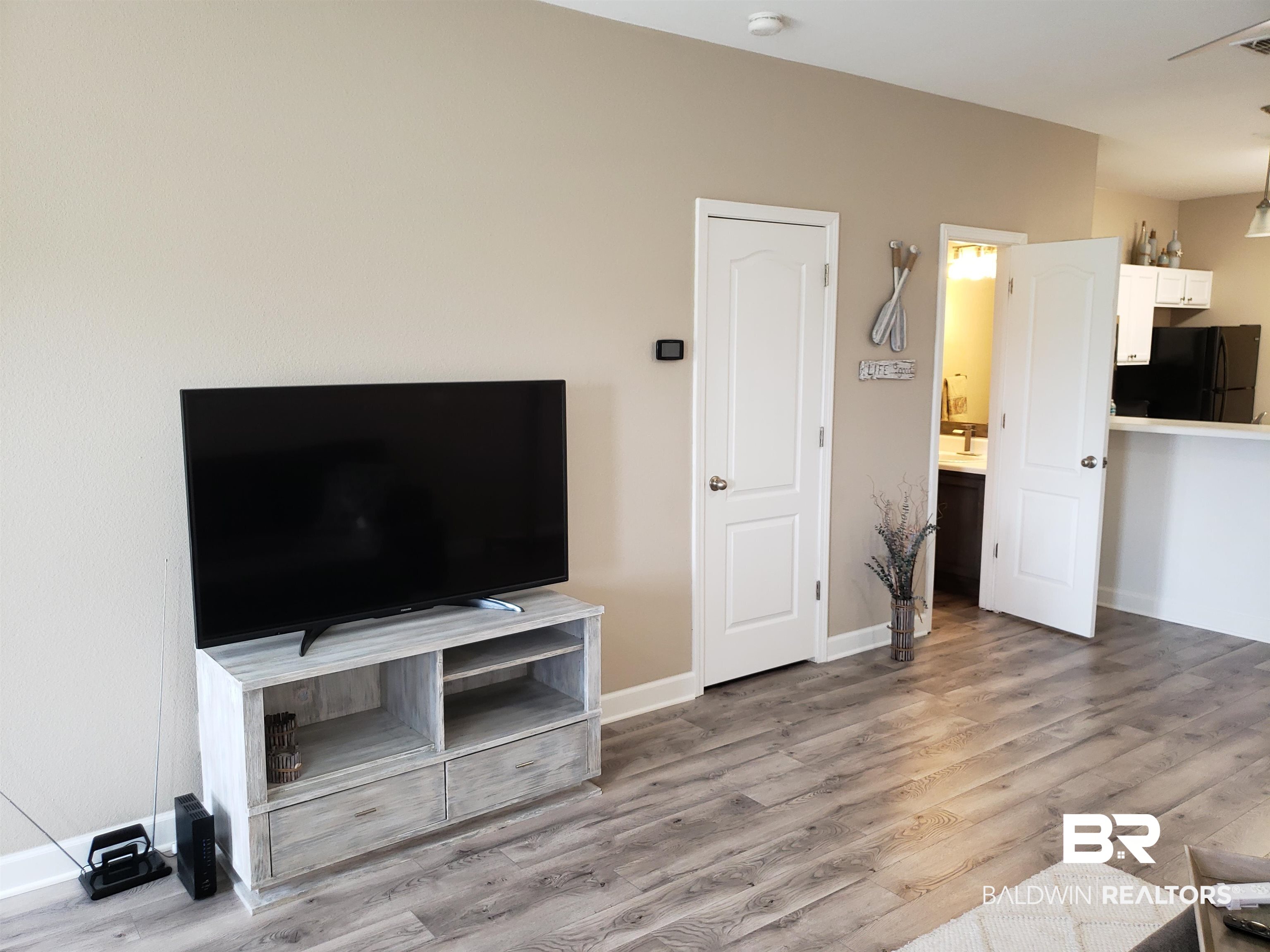 2006 Shelene Way, Unit 2006 Foley, AL 36535 - Photo 5 of 29 Living room featuring light wood finished LVP floors and new baseboards