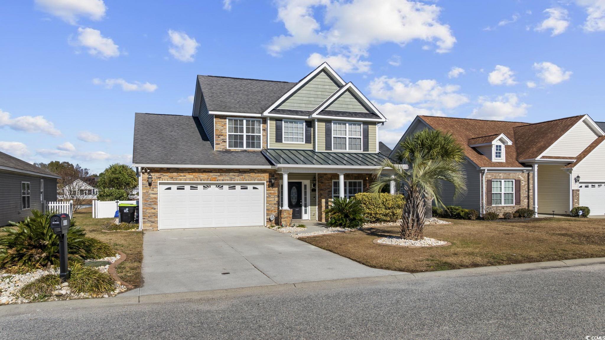 418 Cabo Loop Myrtle Beach, SC 29588 - Photo 2 of 40 View of front of property with concrete driveway, a porch, a garage, stone siding, and roof with shingles
