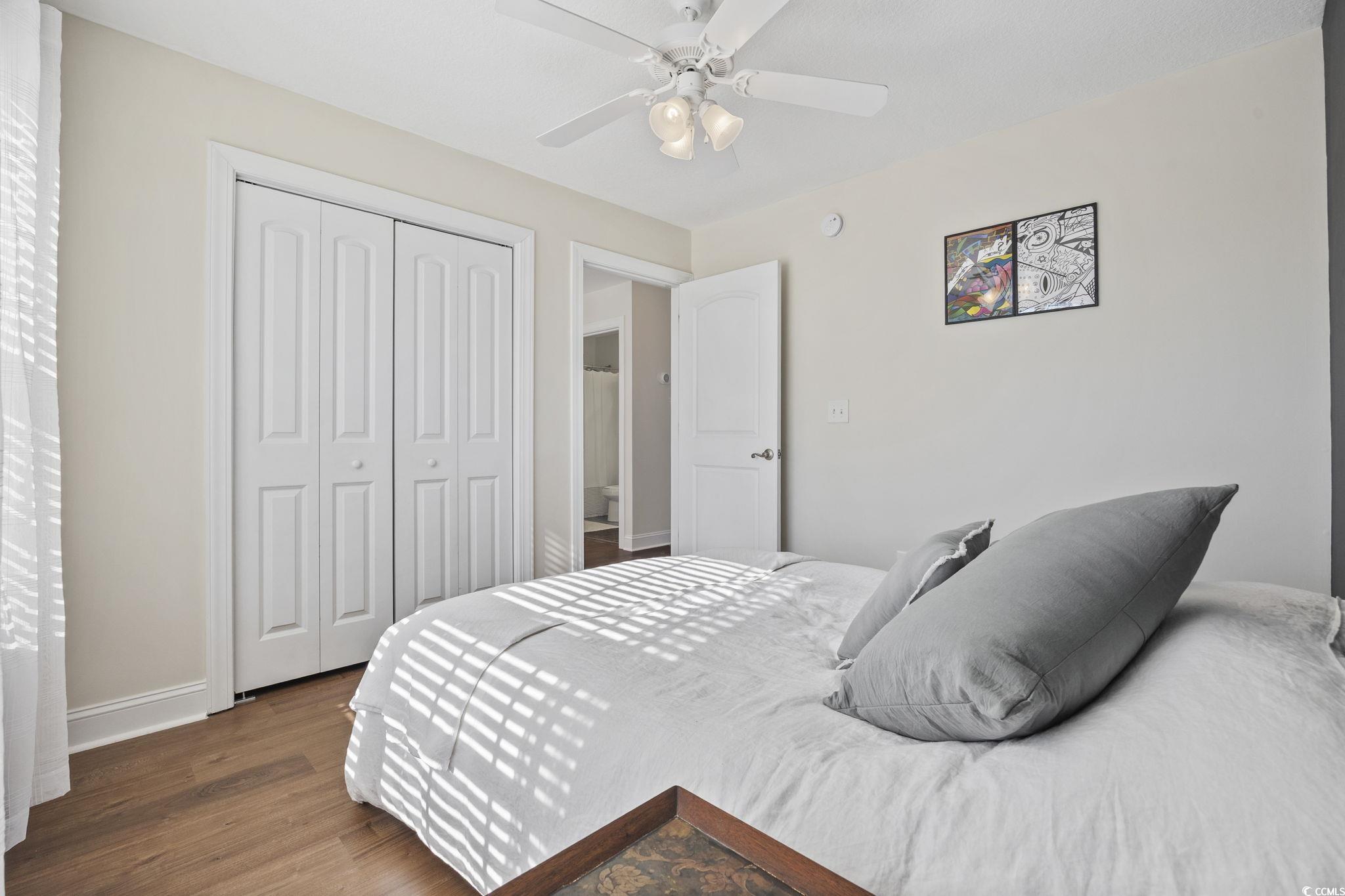 418 Cabo Loop Myrtle Beach, SC 29588 - Photo 23 of 40 Bedroom with wood finished floors, a closet, and a ceiling fan