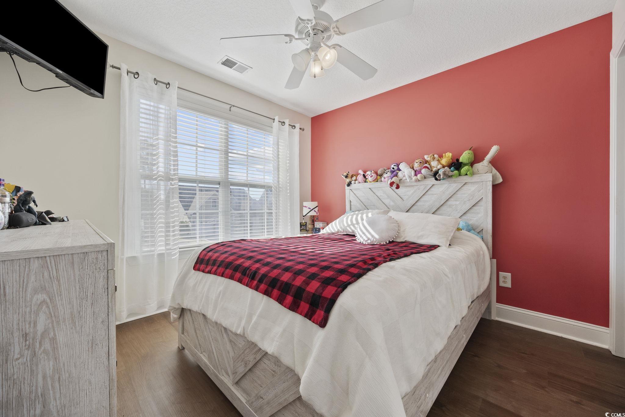 418 Cabo Loop Myrtle Beach, SC 29588 - Photo 24 of 40 Bedroom featuring dark wood-style flooring and a ceiling fan