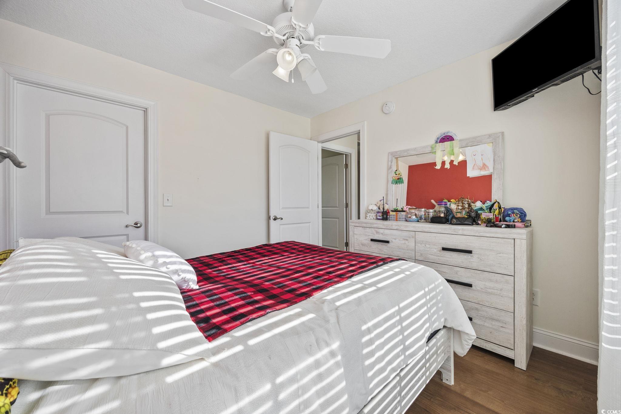 418 Cabo Loop Myrtle Beach, SC 29588 - Photo 25 of 40 Bedroom featuring wood finished floors and ceiling fan