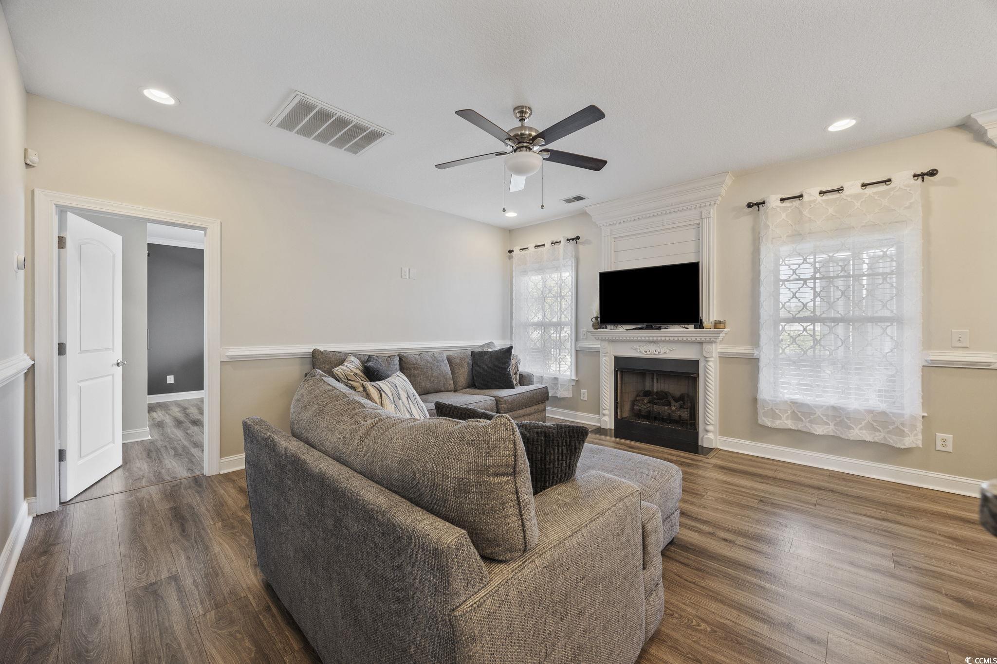 418 Cabo Loop Myrtle Beach, SC 29588 - Photo 4 of 40 Living room featuring a fireplace, recessed lighting, dark wood-style flooring, and ceiling fan