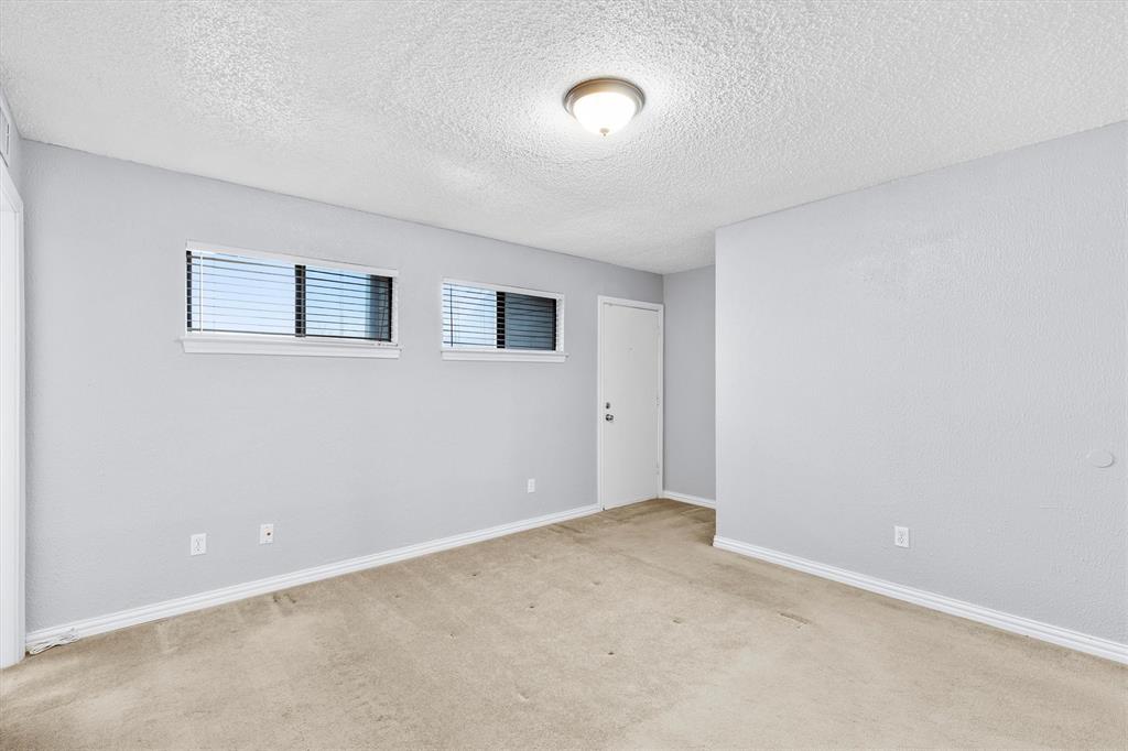 5840 Spring Valley Road, Unit 912 Dallas, TX 75254 - Photo 11 of 33 a view of an empty room with a window
