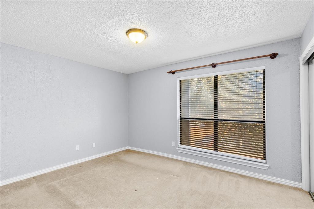 5840 Spring Valley Road, Unit 912 Dallas, TX 75254 - Photo 19 of 33 a view of an empty room with a window