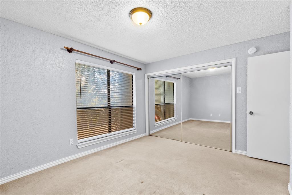5840 Spring Valley Road, Unit 912 Dallas, TX 75254 - Photo 21 of 33 a view of an empty room with a window and outer view