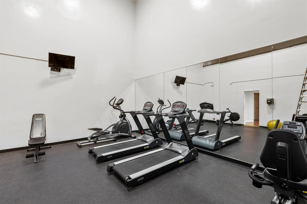 5840 Spring Valley Road, Unit 912 Dallas, TX 75254 - Photo 26 of 33 a view of a room with gym equipment